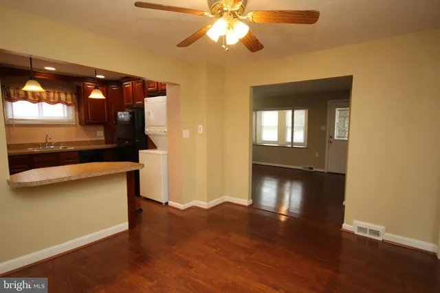 a view of a livingroom with furniture and wooden floor