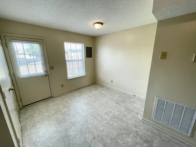 an empty room with windows