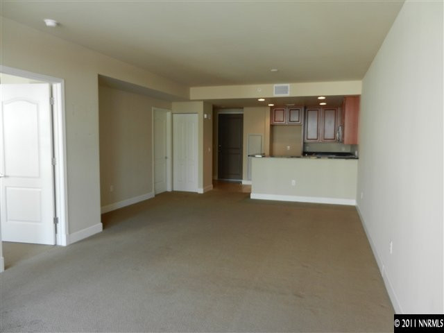 50 North Sierra Street, Unit 605 Reno, NV 89501 - Photo 6 of 11 an empty room with a fireplace
