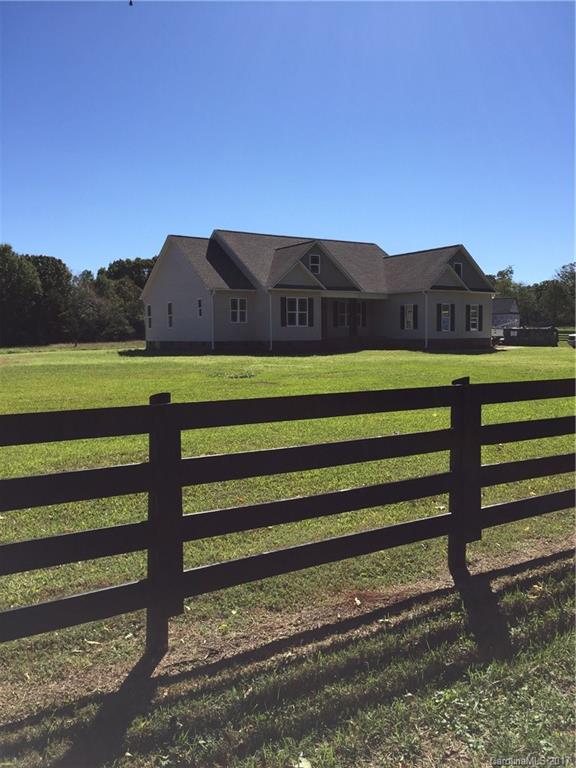 1854 State Rd S-46-168, Unit 4 York, SC 29745 - Photo 6 of 20 a view of a yard with wooden fence