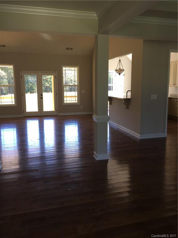 1854 State Rd S-46-168, Unit 4 York, SC 29745 - Photo 7 of 20 a view of empty room with wooden floor and fan