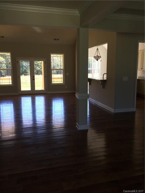 1854 State Rd S-46-168, Unit 4 York, SC 29745 - Photo 8 of 20 a view of empty room with wooden floor and fan
