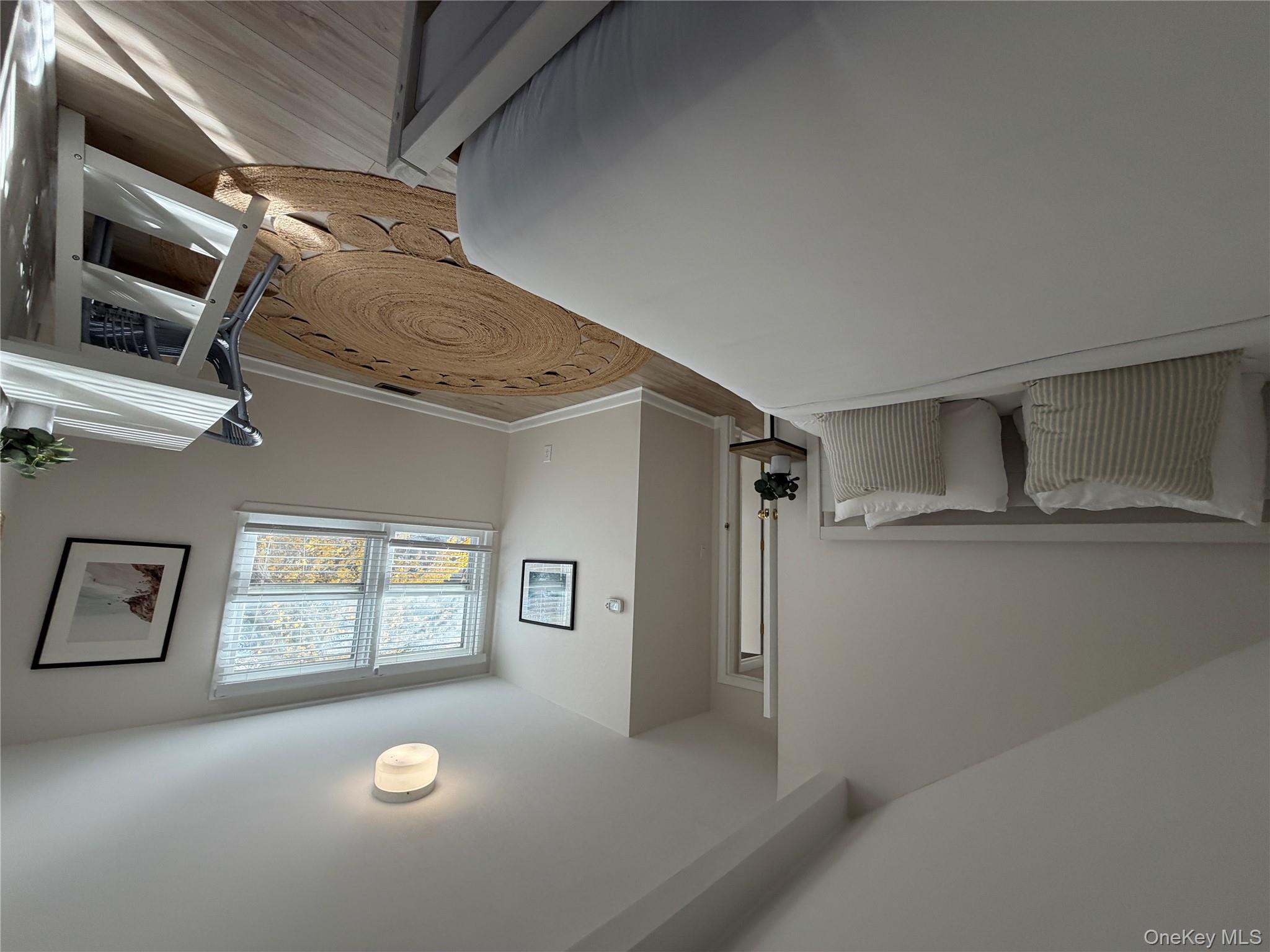 380 Eds Road Southold, NY 11971 - Photo 13 of 19 Bedroom with light wood finished floors and baseboards