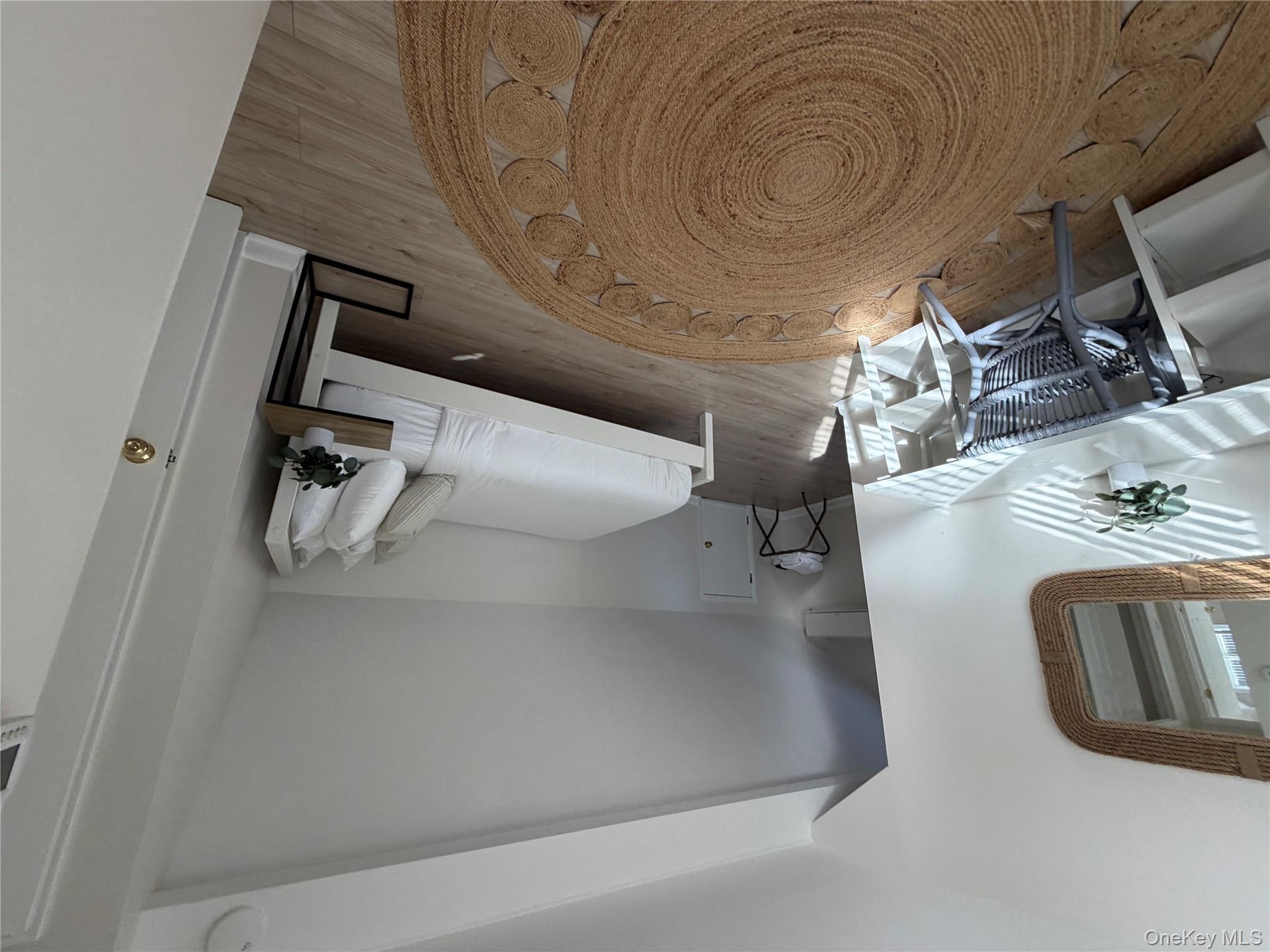 380 Eds Road Southold, NY 11971 - Photo 14 of 19 Bedroom with lofted ceiling and light wood-style flooring