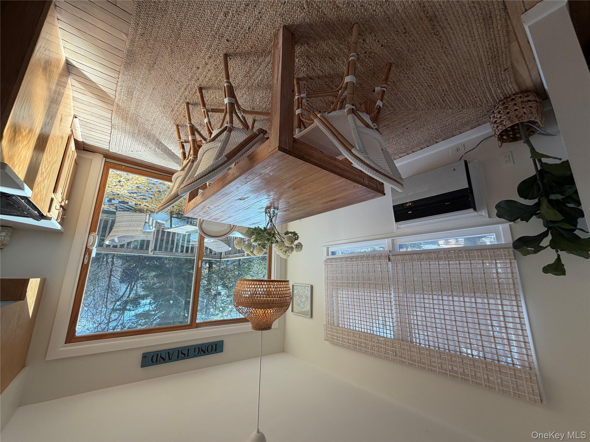 380 Eds Road Southold, NY 11971 - Photo 8 of 19 Dining space featuring heating unit and baseboards