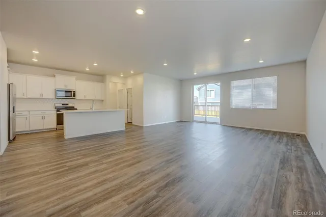 a view of a kitchen with a sink and a stove top oven