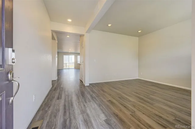 a view of gallery with wooden floor