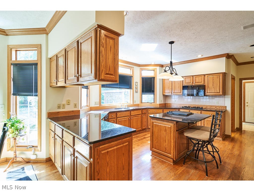 2460 Shadow Ridge Lane Fairlawn, OH 44333 - Photo 6 of 29 Great size kitchen with granite counter tops, and tiled backsplash