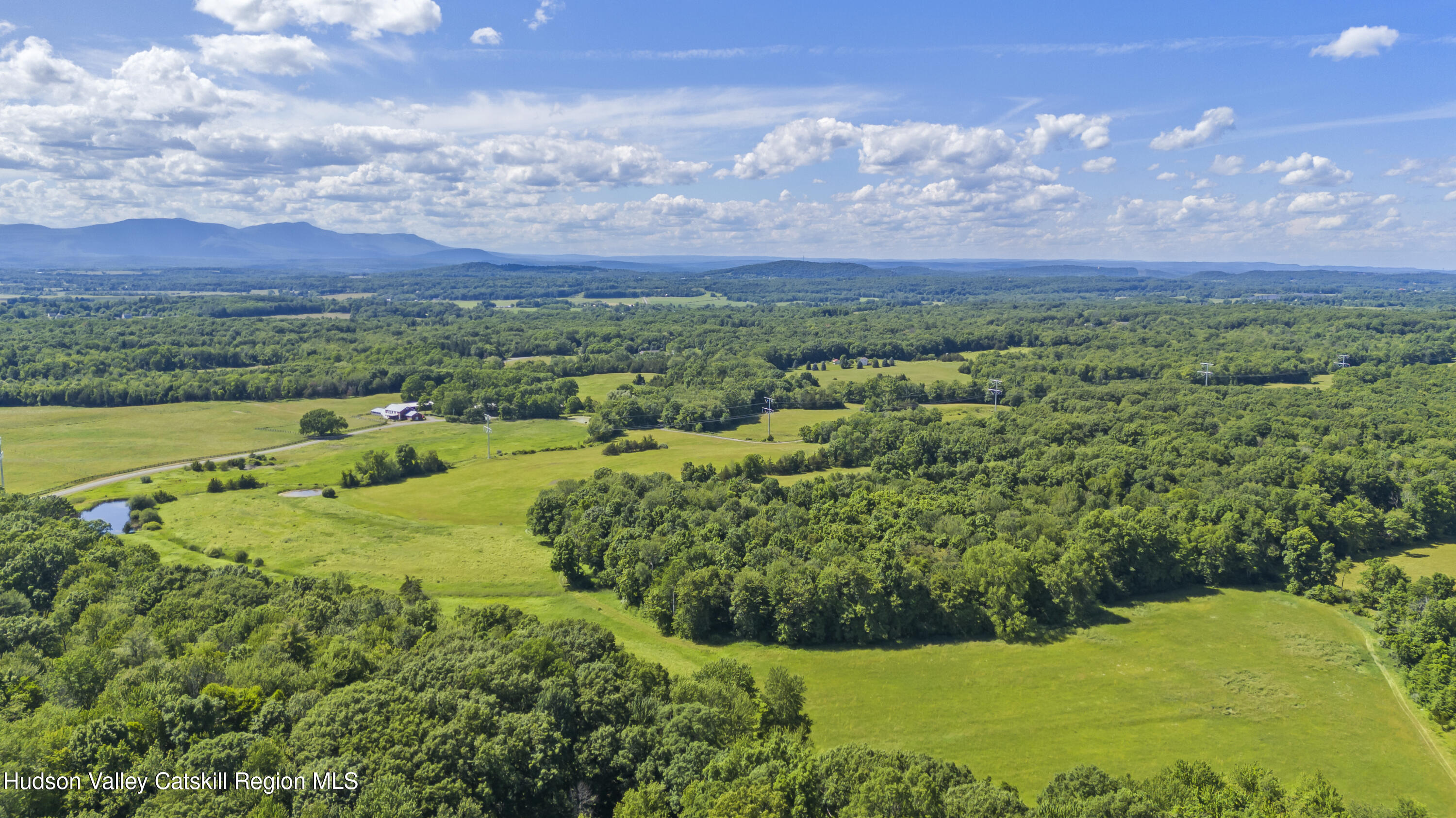 0 Lockwood Road Hudson, NY 12534 - Photo 6 of 11 a view of a city with lush green forest