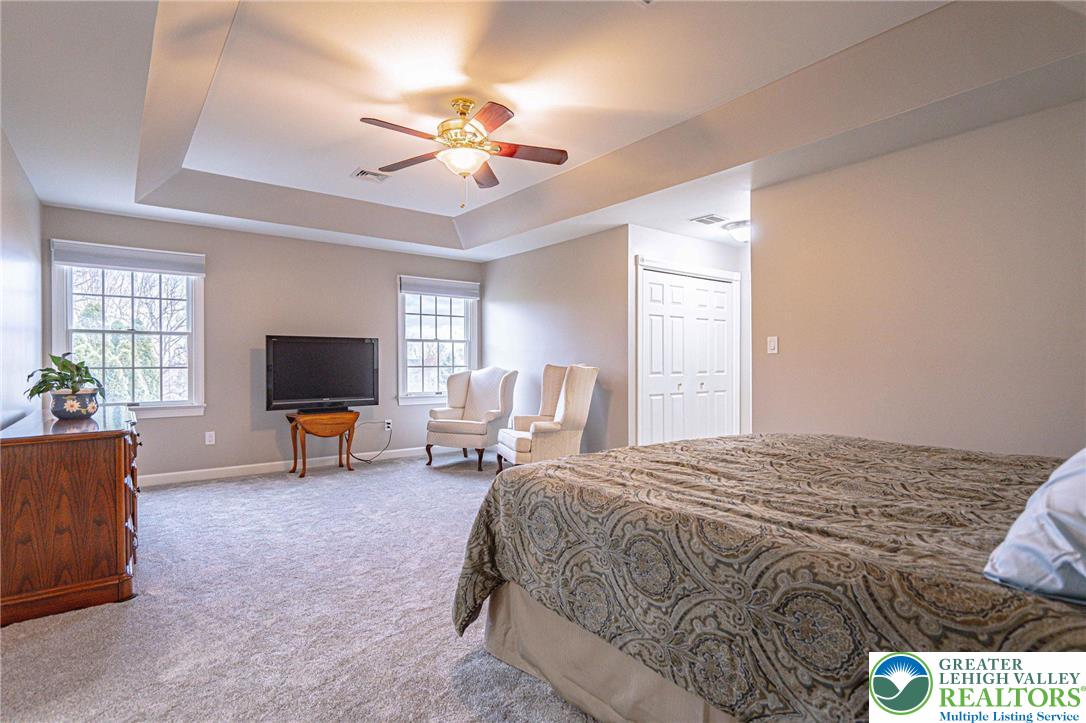 6551 Overlook Road Orefield, PA 18069 - Photo 38 of 82 a spacious bedroom with a bed and a flat screen tv