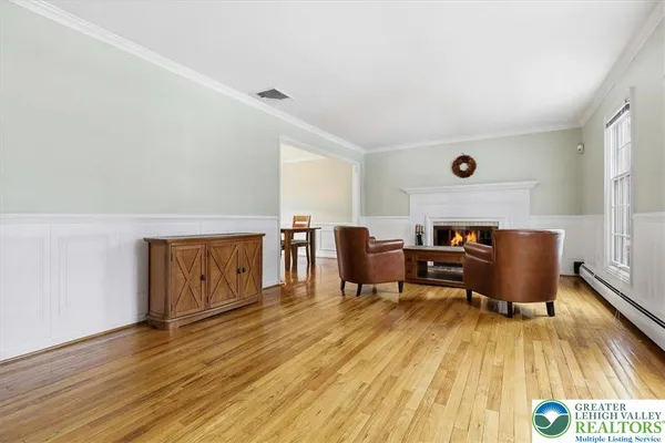 a view of a livingroom with furniture and a flat screen tv