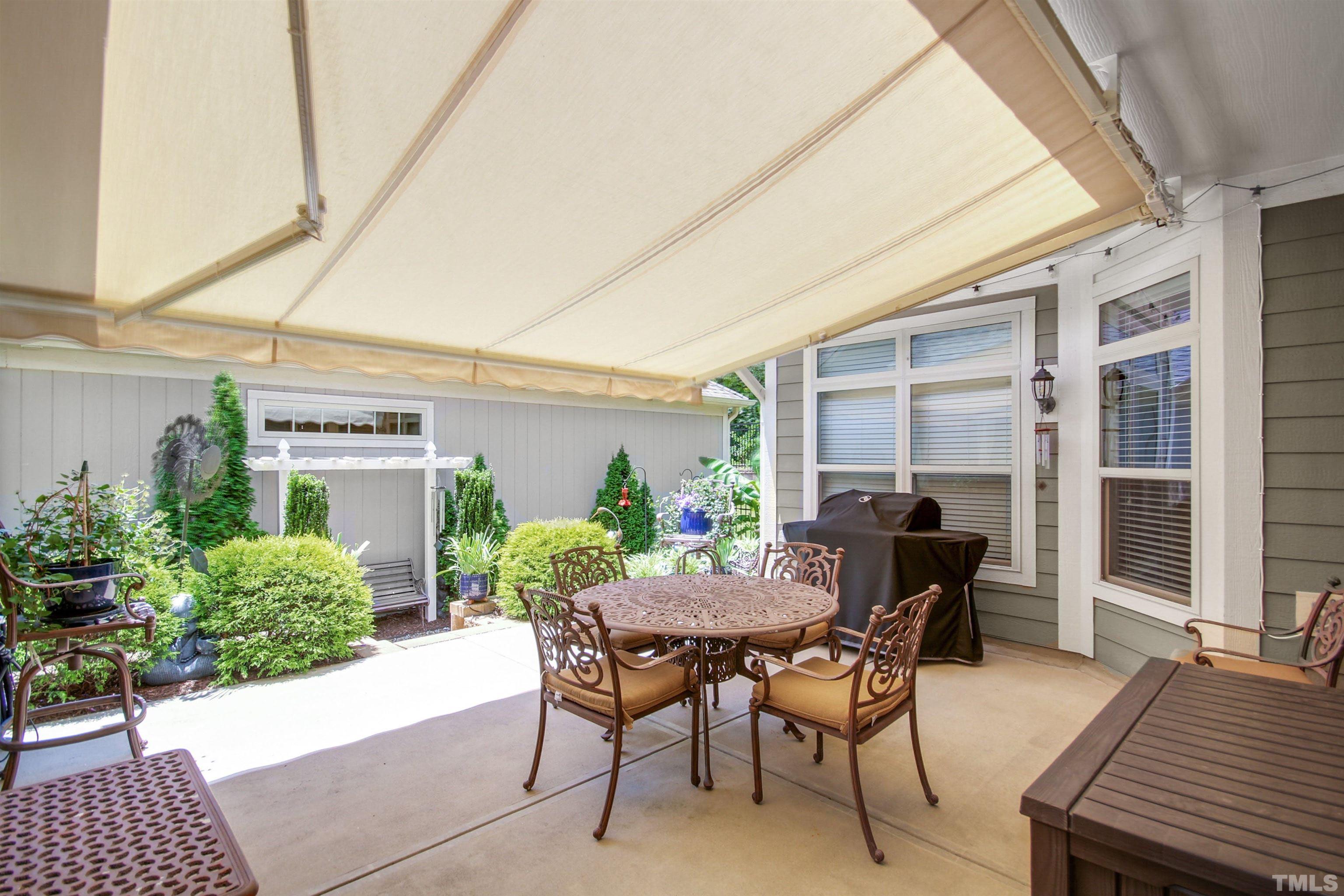 1313 Provision Place Wake Forest, NC 27587 - Photo 1 of 39 a view of a patio with table and chairs and potted plants