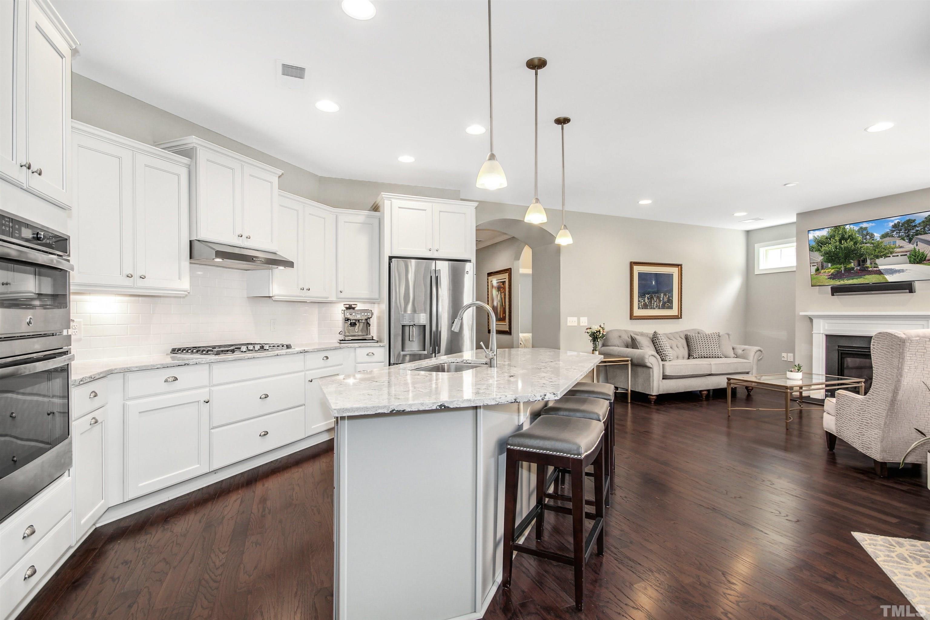 1313 Provision Place Wake Forest, NC 27587 - Photo 14 of 39 a kitchen with white cabinets and stove