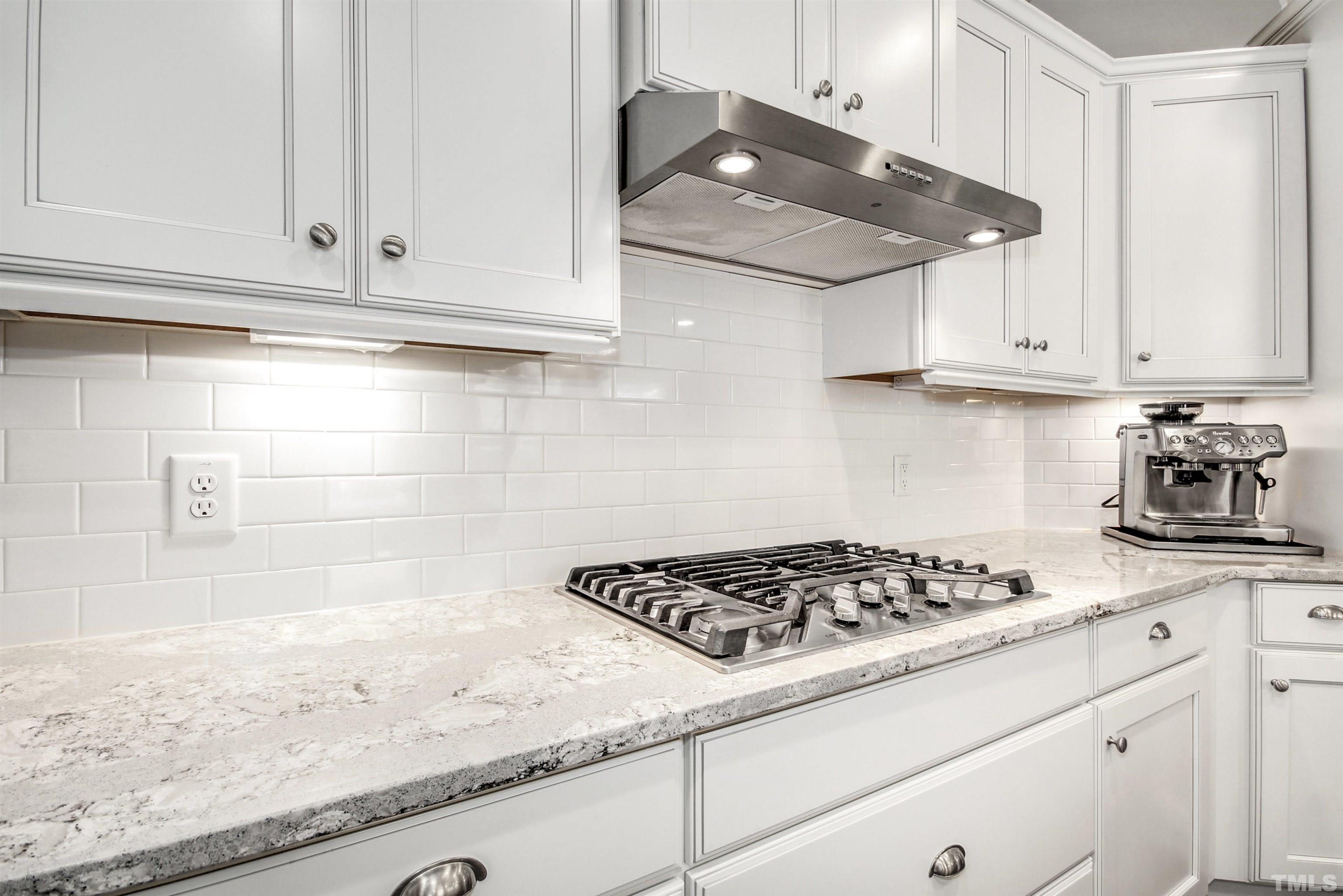 1313 Provision Place Wake Forest, NC 27587 - Photo 15 of 39 a kitchen with granite countertop white cabinets and a stove