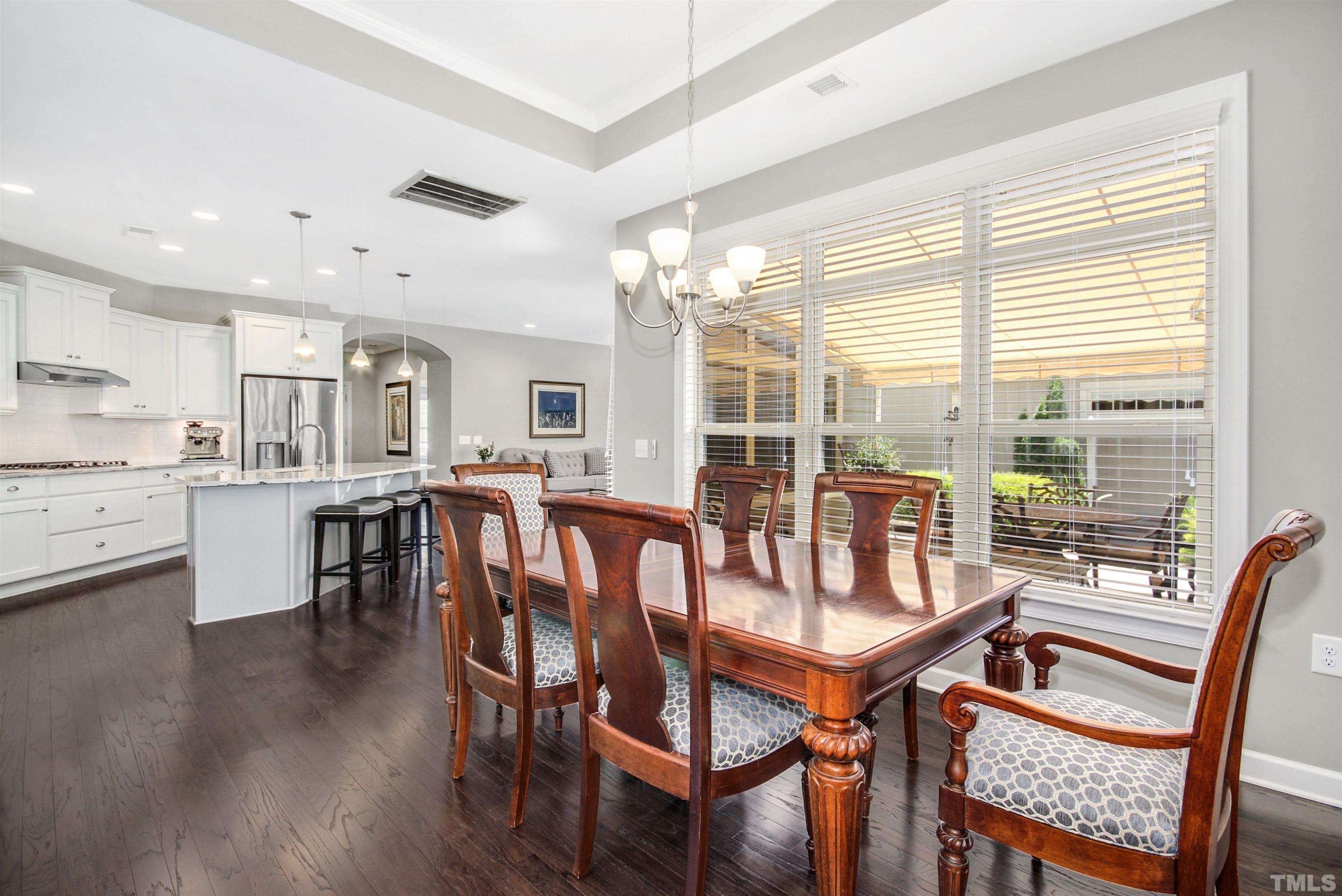 1313 Provision Place Wake Forest, NC 27587 - Photo 18 of 39 a view of a dining room with furniture and wooden floor