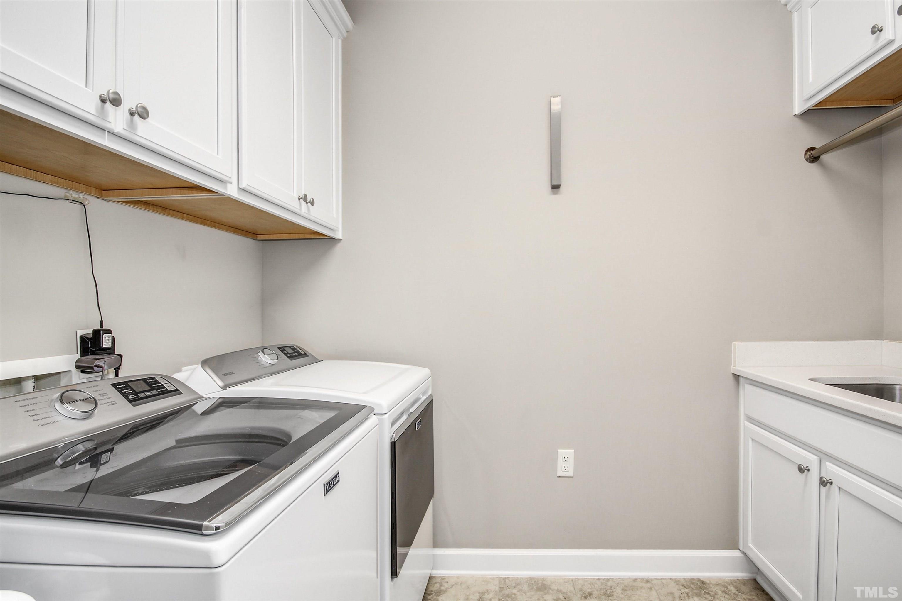 1313 Provision Place Wake Forest, NC 27587 - Photo 20 of 39 a kitchen with a sink cabinets and utility