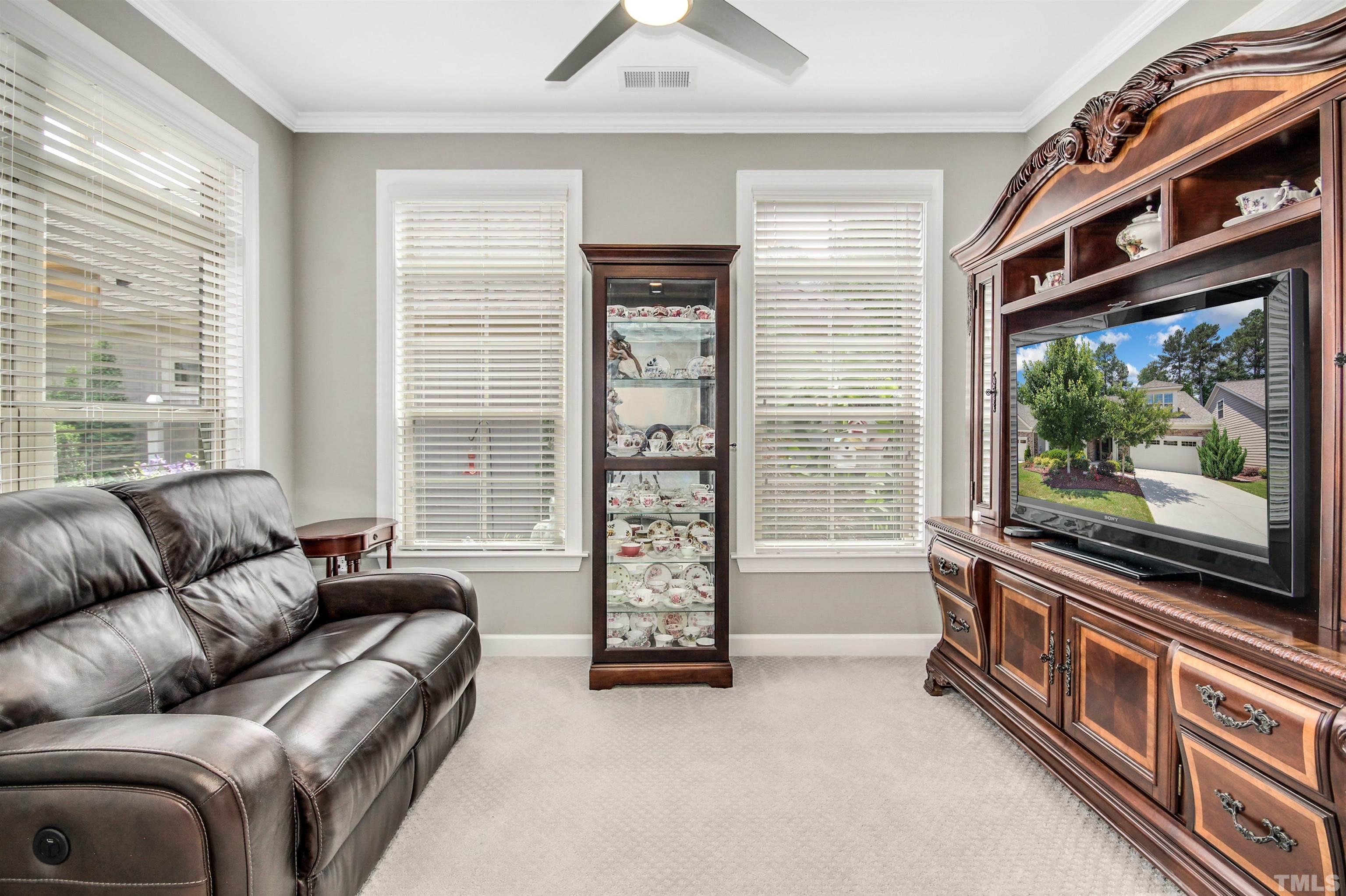 1313 Provision Place Wake Forest, NC 27587 - Photo 24 of 39 a living room with furniture and a flat screen tv