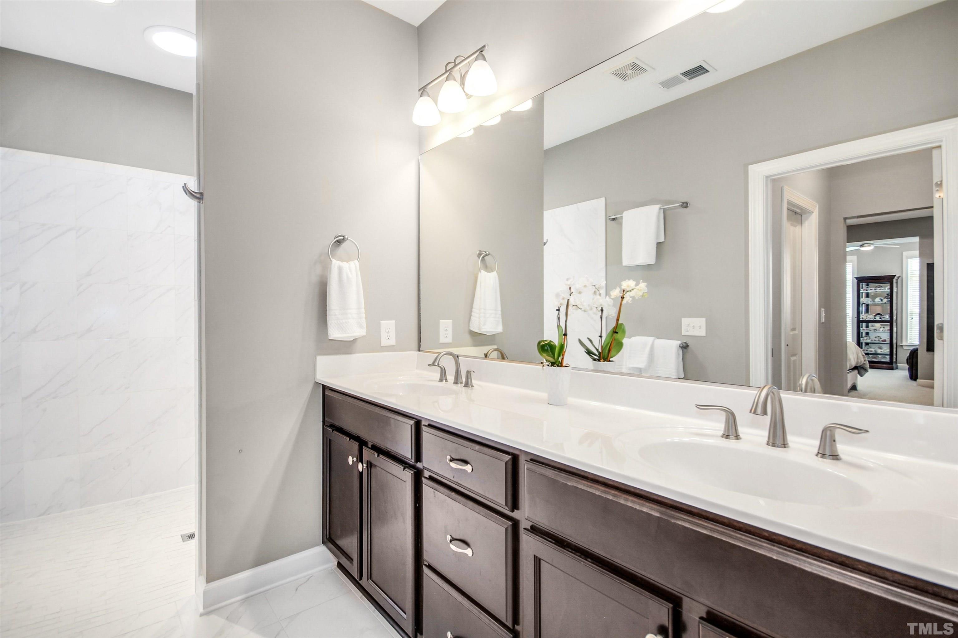 1313 Provision Place Wake Forest, NC 27587 - Photo 26 of 39 a bathroom with a double vanity sink and a mirror