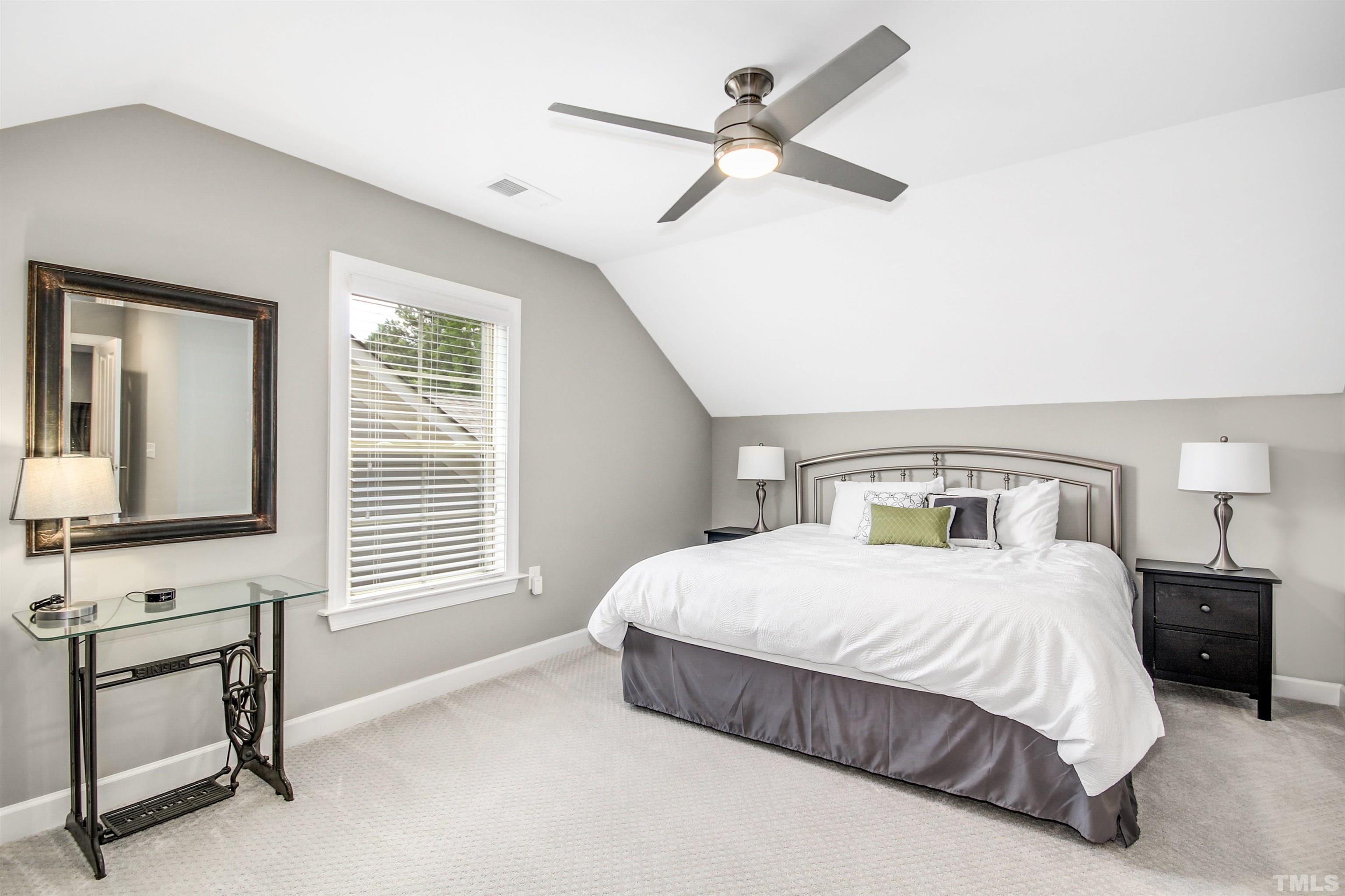 1313 Provision Place Wake Forest, NC 27587 - Photo 31 of 39 a bedroom with a bed a couch and a window