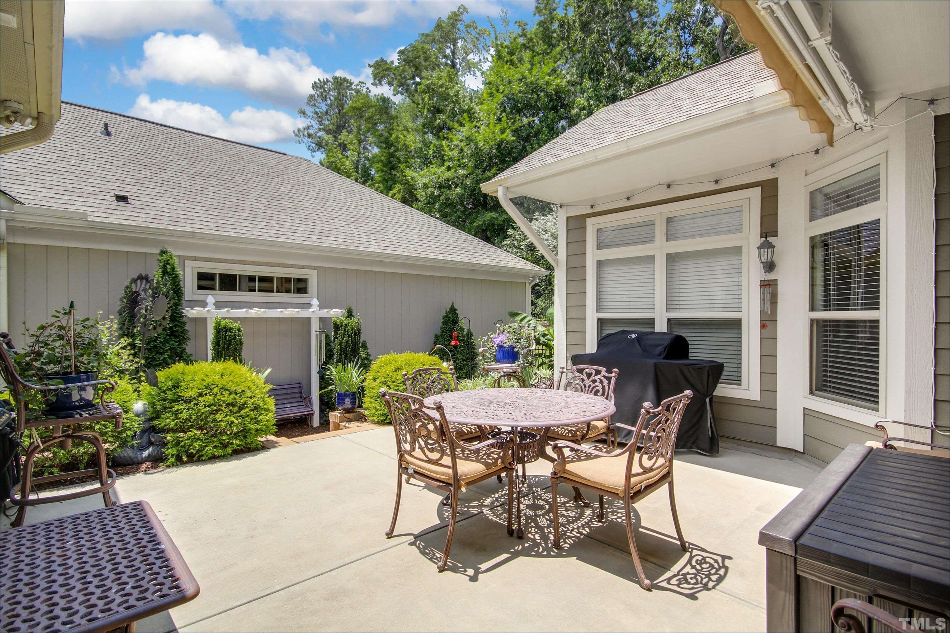 1313 Provision Place Wake Forest, NC 27587 - Photo 34 of 39 a view of a patio with table and chairs and potted plants