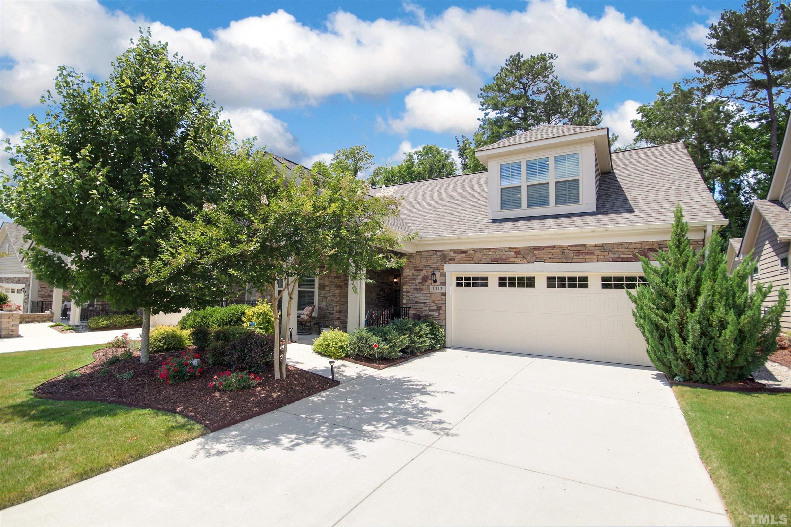 1313 Provision Place Wake Forest, NC 27587 - Photo 4 of 39 a front view of a house with garden