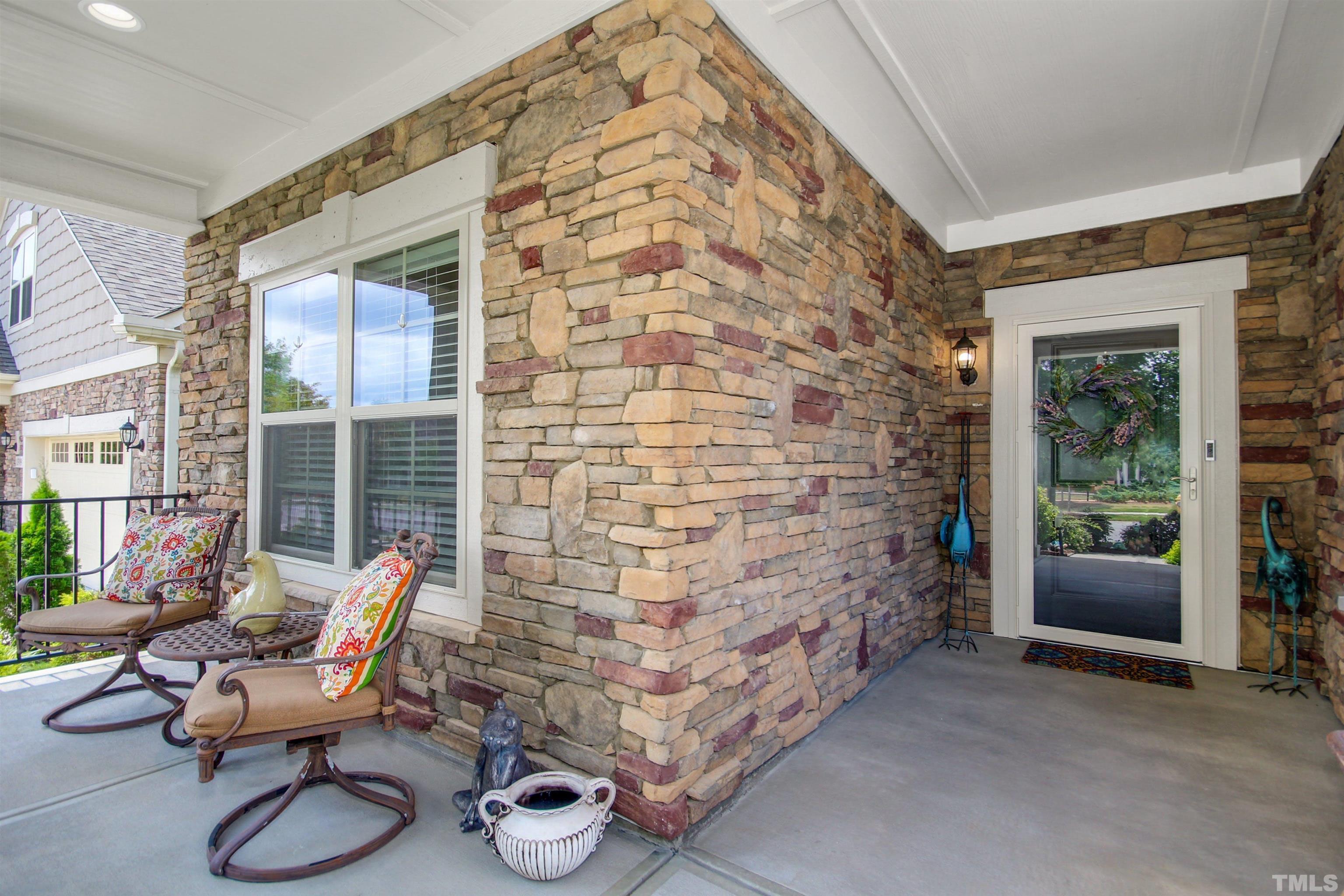 1313 Provision Place Wake Forest, NC 27587 - Photo 6 of 39 a balcony with chairs and a potted plant