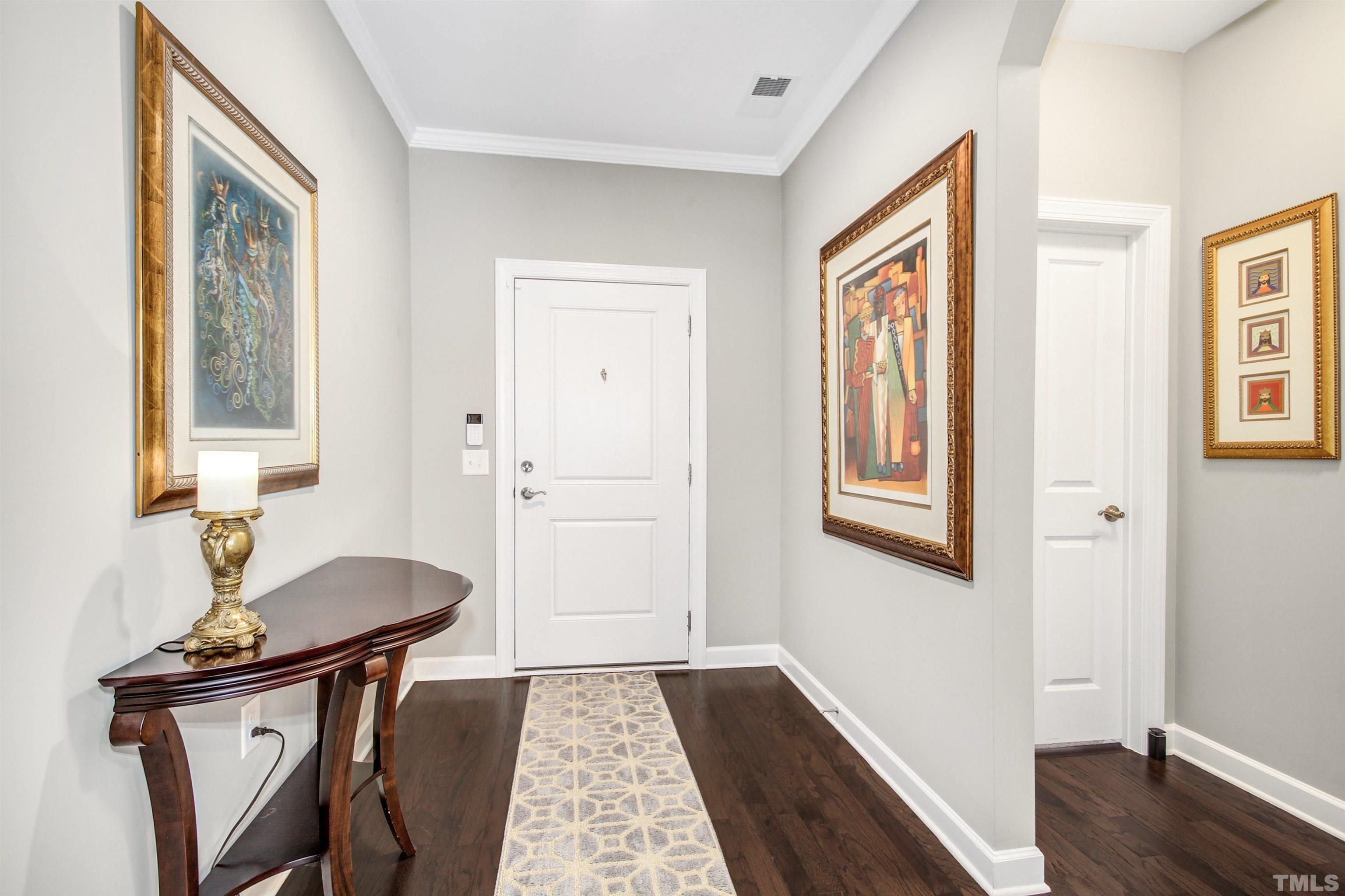 1313 Provision Place Wake Forest, NC 27587 - Photo 7 of 39 a very nice looking room with many windows and wooden floor