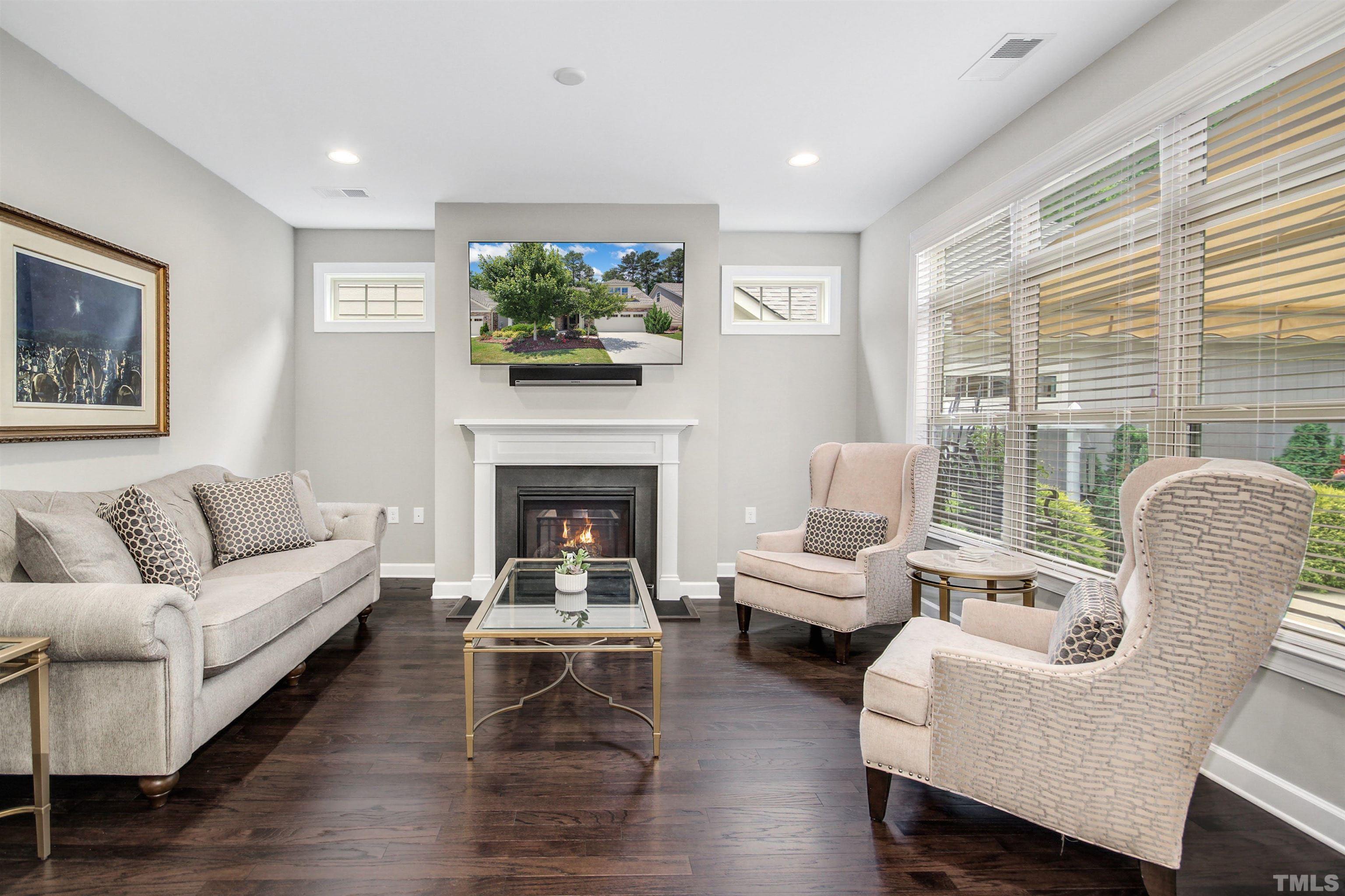 1313 Provision Place Wake Forest, NC 27587 - Photo 9 of 39 a living room with furniture a large window and a fireplace