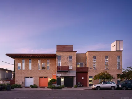 a front view of a building with street view
