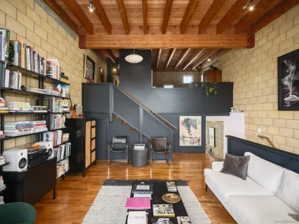 a kitchen with stainless steel appliances kitchen island granite countertop a refrigerator and a stove