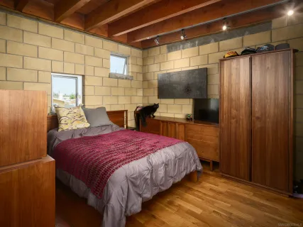 a living room with furniture fireplace and flat screen tv