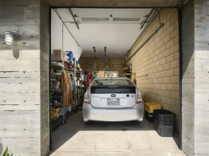a kitchen with a table chairs stove and a microwave oven