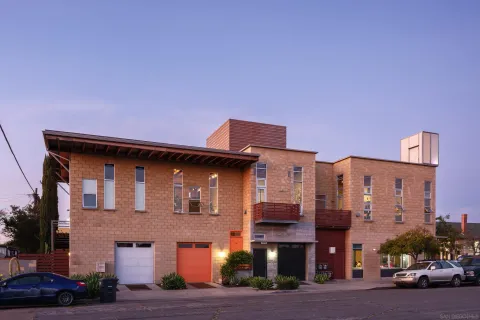 a front view of a building with parking