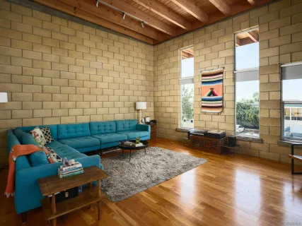 a view of a dining room with furniture and a kitchen
