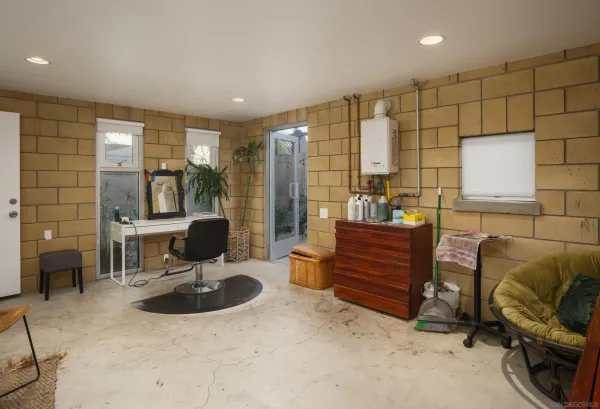 a backyard of a house with table and chairs