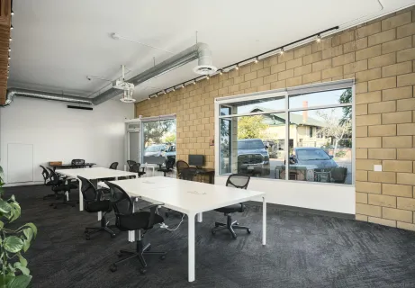 a large white kitchen with a large window