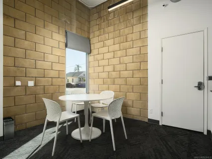a backyard of a house with table and chairs