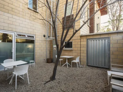 a room with lots of furniture and view of living room