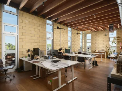 a view of a livingroom with furniture and a window