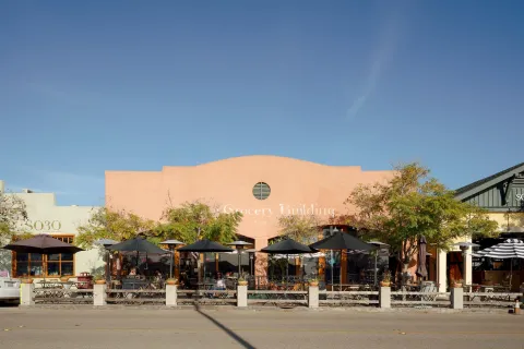 a view of a building with sitting area