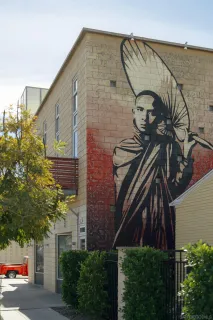 a living room with furniture and a book shelf