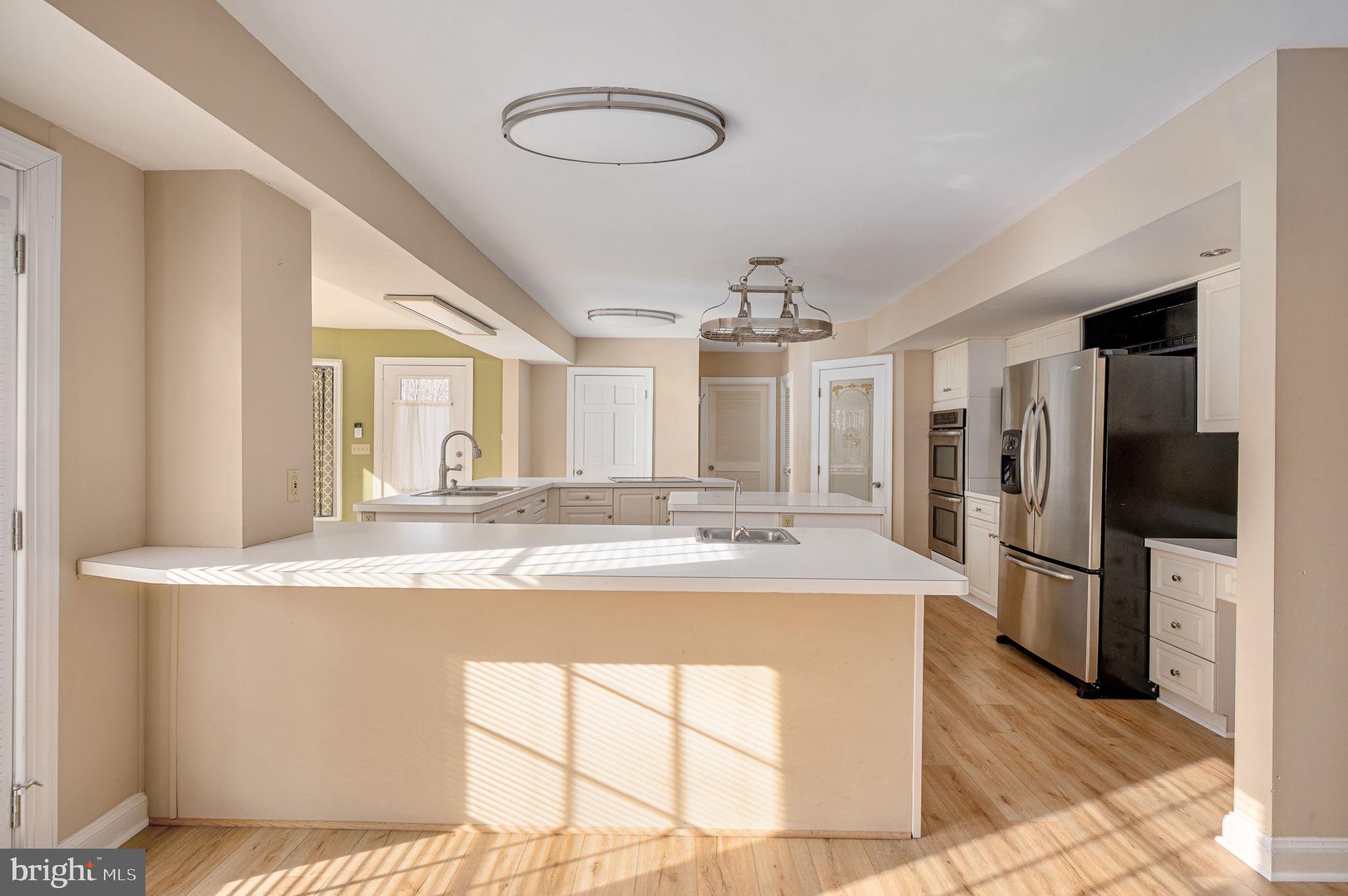 31 River Ridge Lane Fredericksburg, VA 22406 - Photo 12 of 70 a view of a kitchen center island with stainless steel appliances granite countertop cabinets and a counter top space