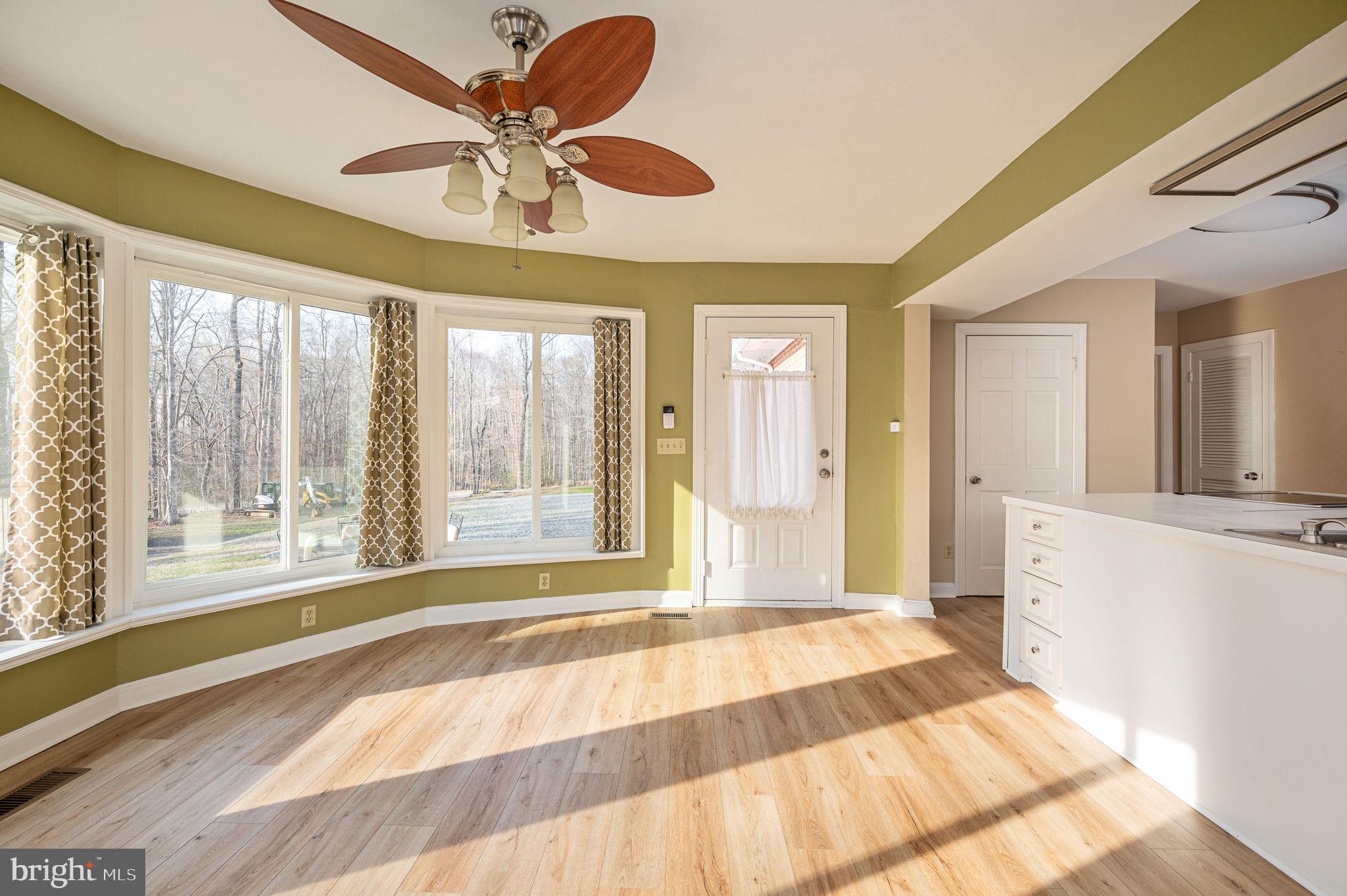 31 River Ridge Lane Fredericksburg, VA 22406 - Photo 14 of 70 a spacious bedroom with a large bed and a large window