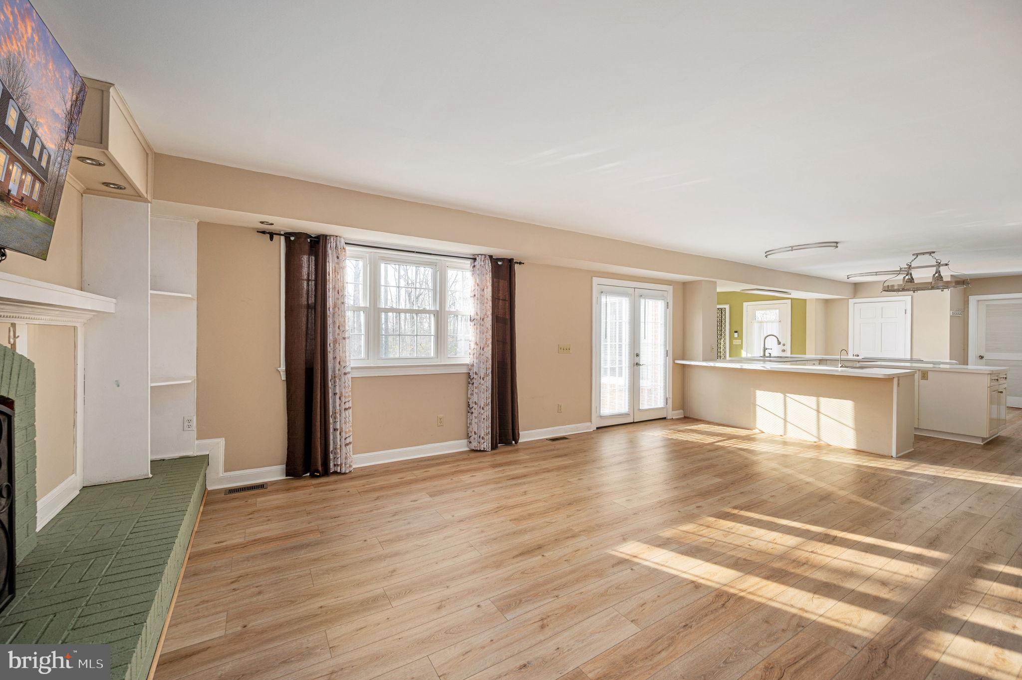 31 River Ridge Lane Fredericksburg, VA 22406 - Photo 18 of 70 a view of empty room with wooden floor and fireplace
