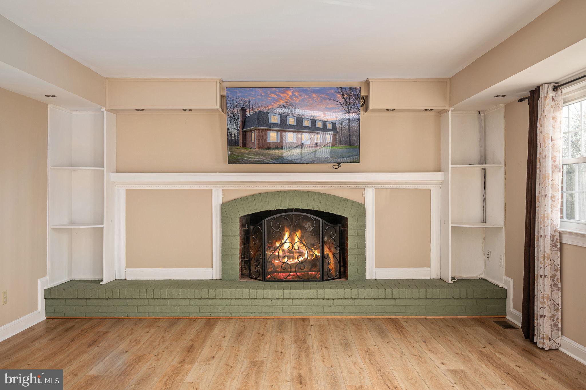 31 River Ridge Lane Fredericksburg, VA 22406 - Photo 19 of 70 a living room with a fireplace and a rug