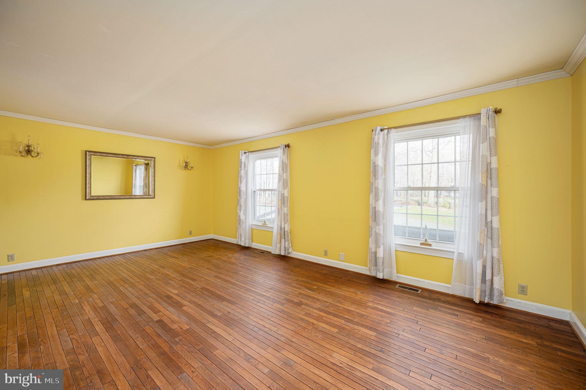 31 River Ridge Lane Fredericksburg, VA 22406 - Photo 26 of 70 a view of an empty room with wooden floor and a window