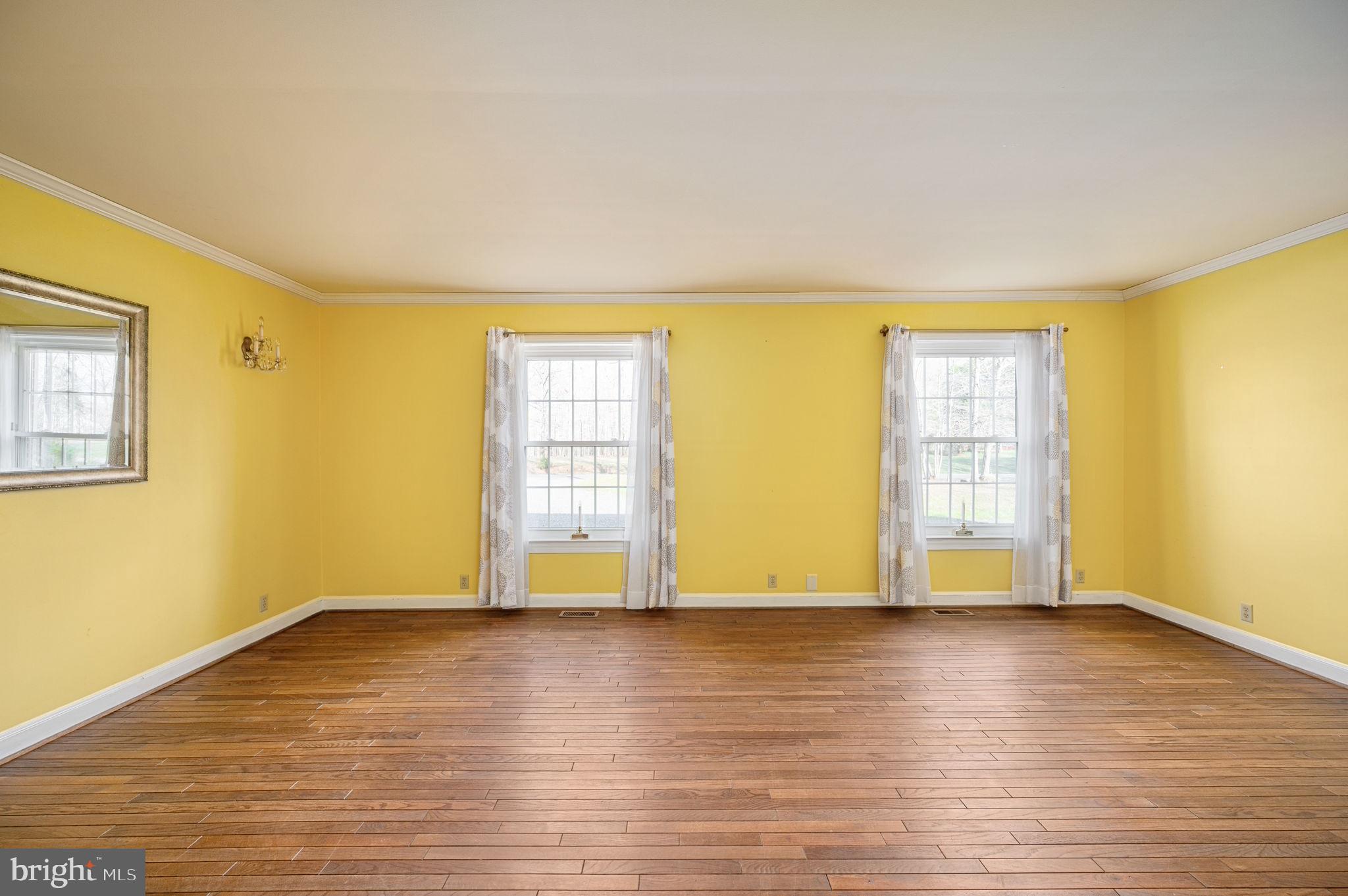 31 River Ridge Lane Fredericksburg, VA 22406 - Photo 27 of 70 a view of an empty room with wooden floor and a window