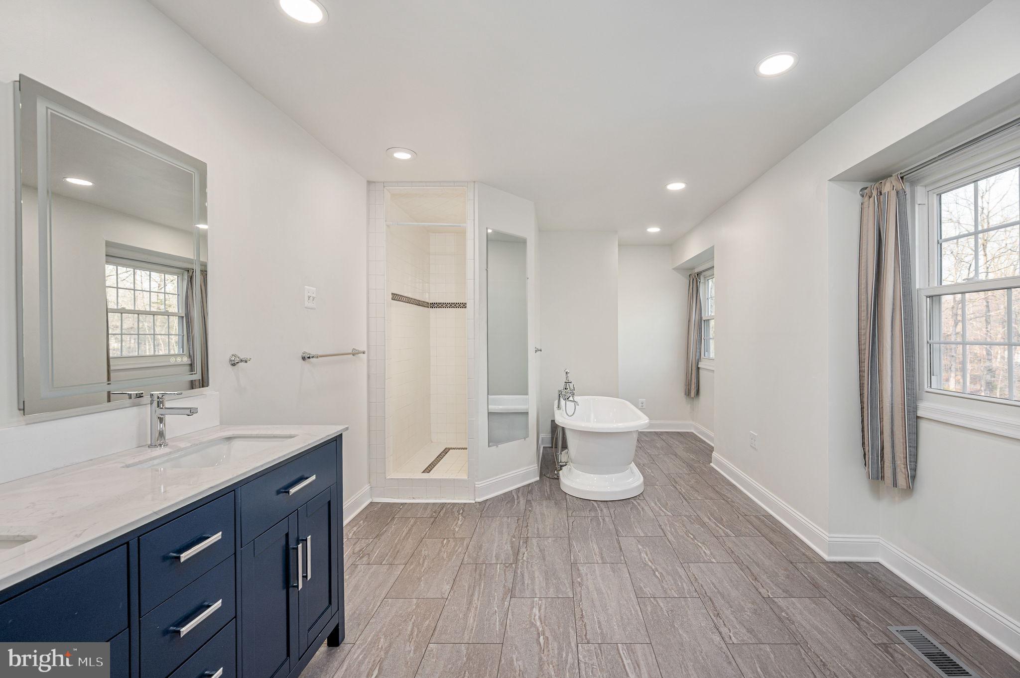31 River Ridge Lane Fredericksburg, VA 22406 - Photo 38 of 70 a spacious bathroom with a double vanity sink a toilet and a window