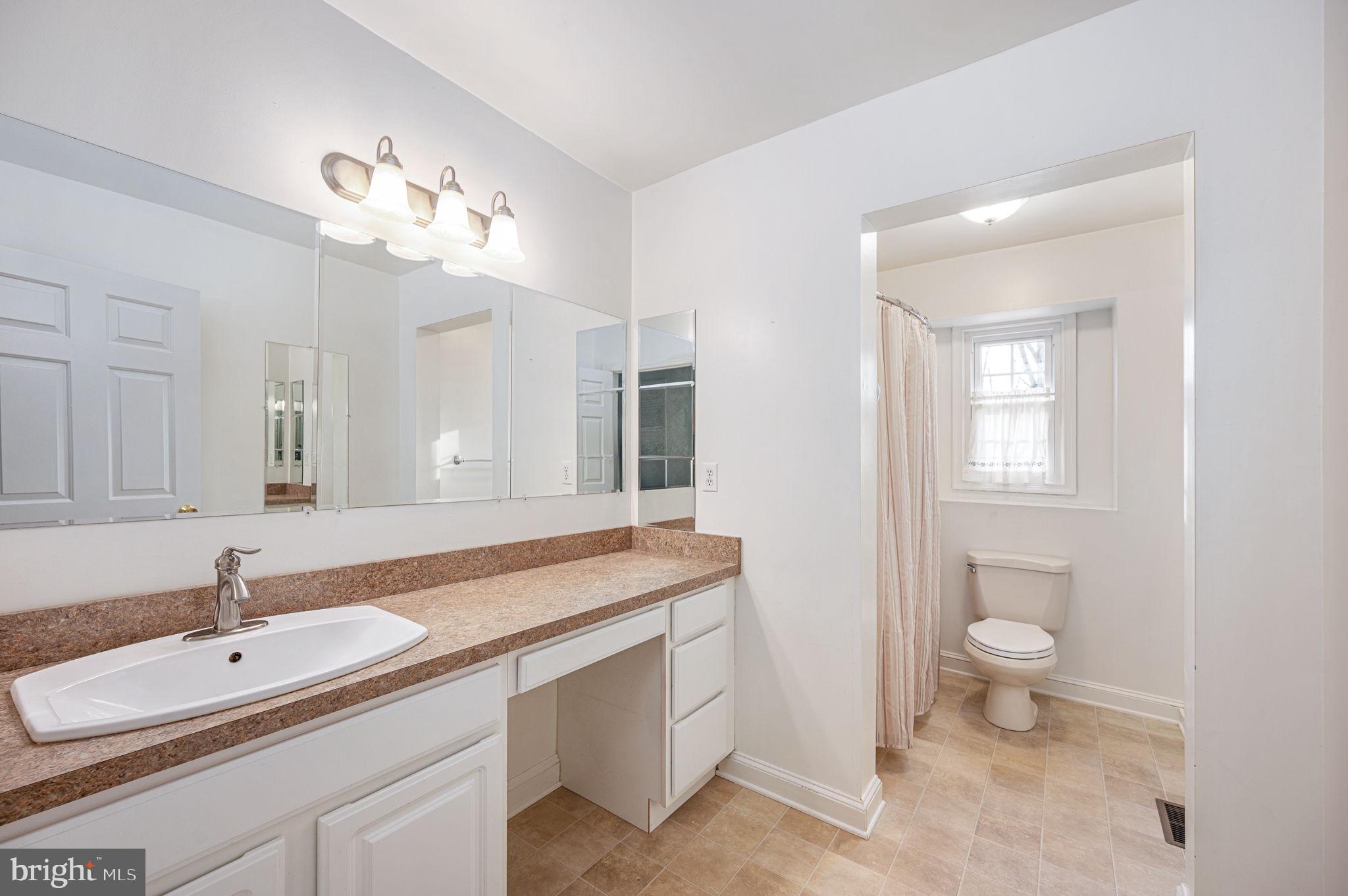 31 River Ridge Lane Fredericksburg, VA 22406 - Photo 46 of 70 a bathroom with a sink double vanity and a toilet