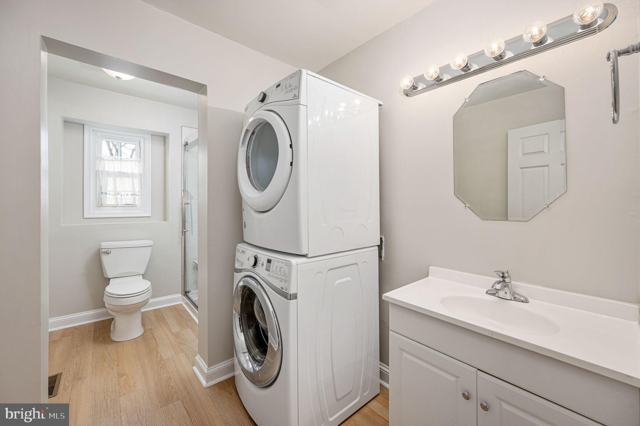 31 River Ridge Lane Fredericksburg, VA 22406 - Photo 50 of 70 a spacious bathroom with a sink a washer and dryer